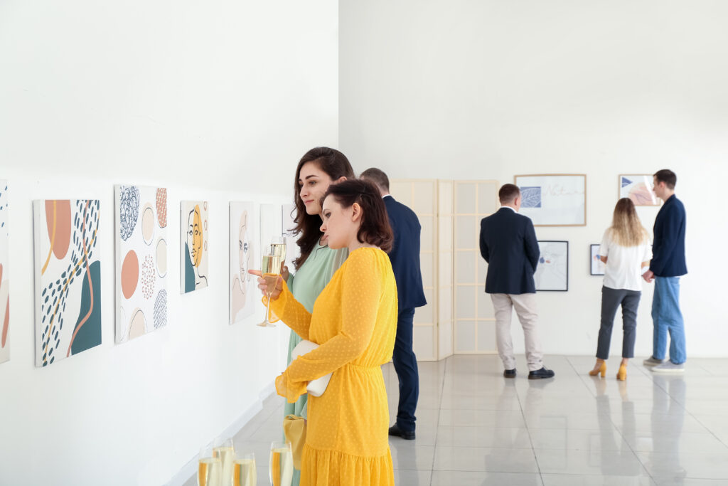 People at exhibition in modern art gallery